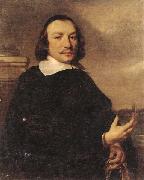 Jan van Noordt Portrait of a gentleman holding gloves,a view of a dutch town beyond oil on canvas
